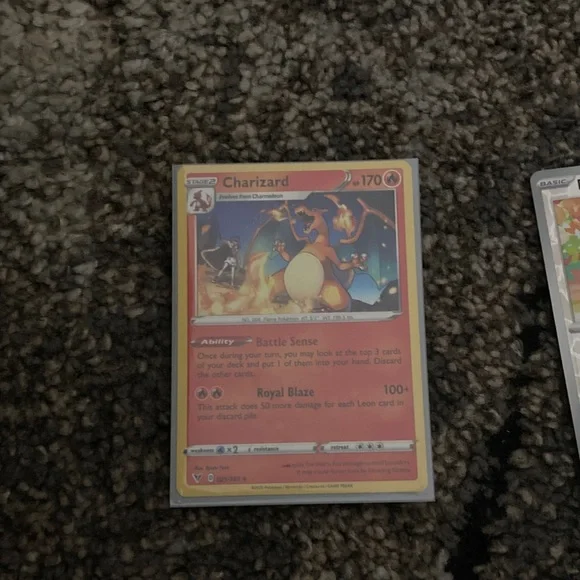 Pokemon Charizard Trading Card - Red and Yellow also has a sleeve - Picture 8 of 9